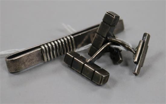 A pair of Georg Jensen silver cufflinks, design no. 64 and a 1960s Georg Jensen silver tie clip, no. 52A.